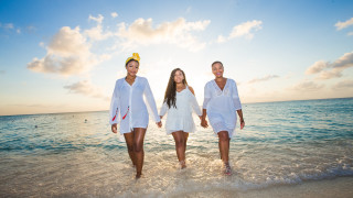 Three women white outfits ocean - dulah marie evans free wallpaper