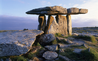 Rock formation liminal deniseden beach - a large rock in the middle of it free wallpaper