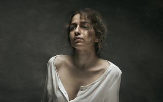 Woman white shirt blowing hair - studio portrait free wallpaper