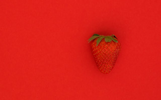 Strawberry red background green stem - single free wallpaper