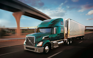 Green semi truck highway bridge - mesh wire free wallpaper