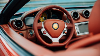 Red car showroom dashboard blurry - a blue wall free wallpaper