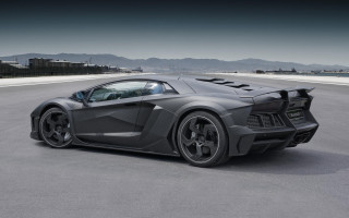 Grey sports car mountain road - a grey sports car free wallpaper