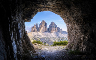 Mountain range through cave dirt - a dirt path free wallpaper