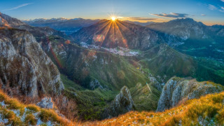 Mountain sunset valley grassland lake - below free wallpaper