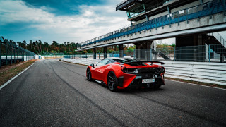 Red sports car racetrack bridge - a tall building free wallpaper