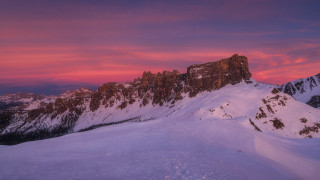 Snowy mountain pink sky city - widescreen free wallpaper