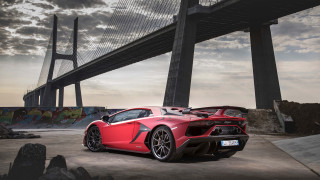 Red sports car bridge clouds - a red sports car free wallpaper
