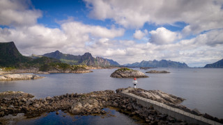 Lake mountains rock outcrop bridge - the middle of a lake free wallpaper