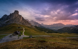 Mountain range road sunset clouds - a sunset in the background free wallpaper