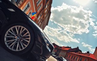 Car parked building flag cinematic - the side of a road next free wallpaper