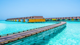 Wooden walkway houses water beach - the water near a beach free wallpaper