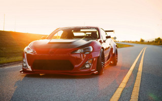 Red sports car sunset matte 2 - andrew bell free wallpaper