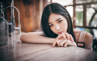 Woman wine table blackhair blurry - a bottle of wine free wallpaper