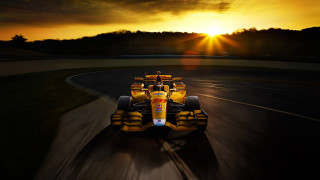 Yellow race car sunset landscape - the sun behind free wallpaper