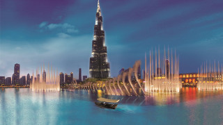 Boat fountain tallbuilding skyline night - a tall building free wallpaper