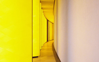 Long hallway yellow walls clock - the wall and a clock free wallpaper