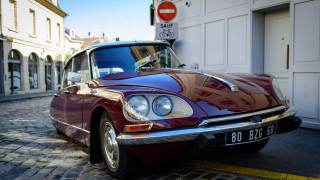Red car parked road building - corneille free wallpaper