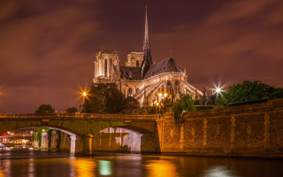Bridge cathedral city lights night - a bridge over a river free wallpaper