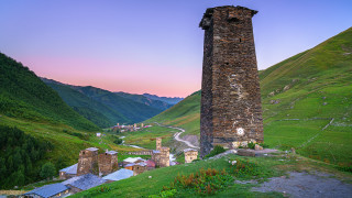 Tall tower hillside valley road - a tall tower free wallpaper