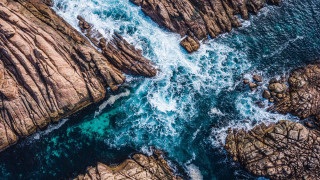 Rocky coastline blue ocean night - a blue ocean below free wallpaper