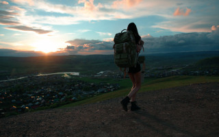 Woman backpack hill sunset town - alena aenami free wallpaper