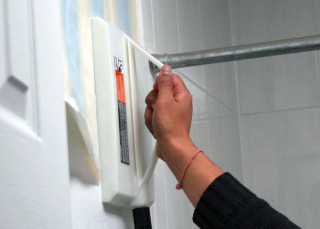 Person holding white object wall - detail free wallpaper