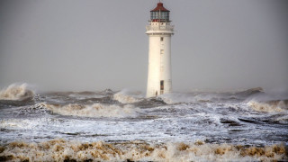 Lighthouse waves ocean cloudy day - stormy weather free wallpaper