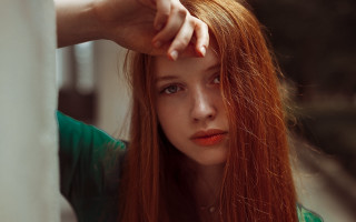 Woman redhair leaning wall serious - against a wall free wallpaper