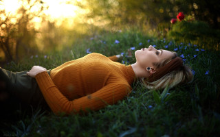 Woman field flowers sunshine portrait - the ground in a field of grass free wallpaper
