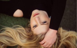 Blonde woman laying illusion portrait - optical free wallpaper
