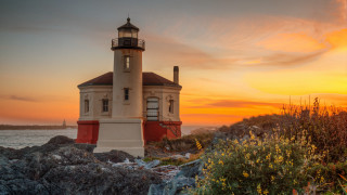 Lighthouse rocky shore sunset ocean 5 - a rocky shore free wallpaper
