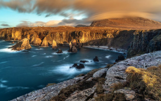 Rocky cliff ocean mountains rainbow - a rocky cliff free wallpaper
