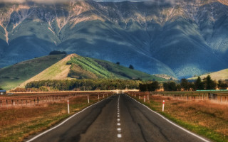 Long road mountain cloudy sky - a cloudy sky above free wallpaper