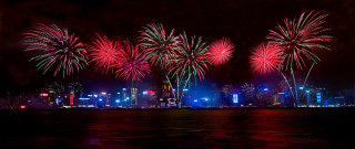 Fireworks city skyline night water - international typographic style free wallpaper