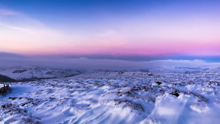 Snowy landscape pink sky mountains - rich moody colour free wallpaper