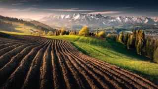 Plowed field mountains sunset sky - beautiful landscape free wallpaper