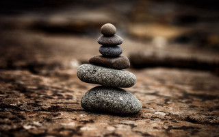 Stacked rocks forest sunset blurry - symmetric balance free wallpaper