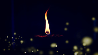 Candle flame dark snow blur - radiant free wallpaper