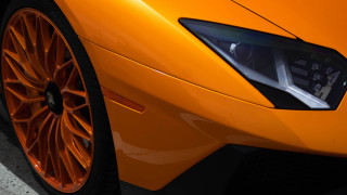 Bright orange sports car front - photorealism free wallpaper