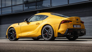 Yellow sports car building side - a large window free wallpaper