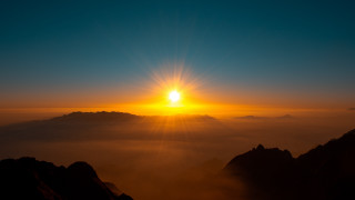Sunset mountain range clouds ocean - arthur pan free wallpaper