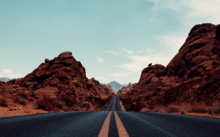 Mountain road clouds desert landscape - a road free wallpaper