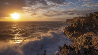 Sunset ocean waves cliff house - a sunset over the ocean free wallpaper