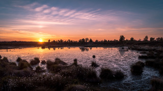 Sunset lake boats trees clouds 2 - a sunset over a lake free wallpaper