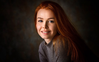 Woman red hair smiling dark - long red hair free wallpaper
