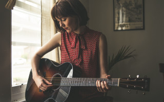 Woman playing guitar room window - a guitar in a room free wallpaper