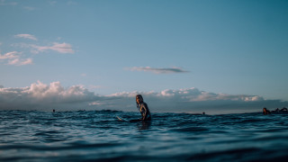 Woman surfboard ocean background clouds - a surfboard in the ocean free wallpaper