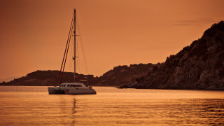 Sailboat rocky shore sunset mountain - antoni pitxot free wallpaper