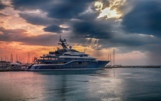 Large boat dock sunset clouds - rich moody colour free wallpaper